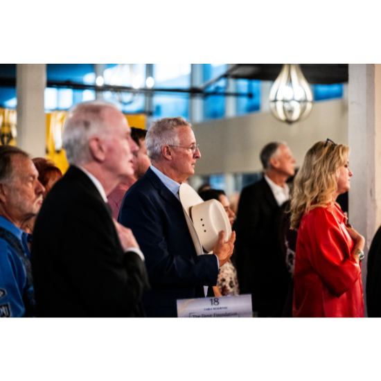 The scholarship recipient is presented their award