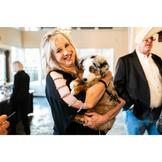 Supporters celebrate at the Stockyards